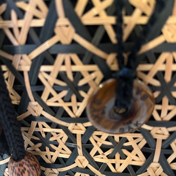 The Sak Black and Tan Straw Bag with Ornate Design Inner Drawstring Liner - Picture 2 of 8